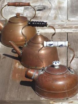 catalog photo of collection of vintage copper kettles, whistling tea kettle & teapots