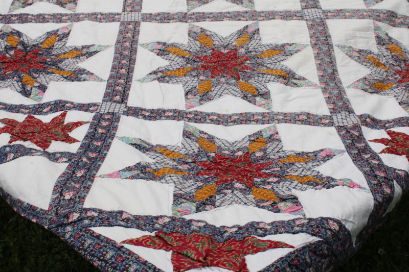 photo of cotton patchwork quilt eight pointed stars dark blue, barn red, yellow gold prints on white  #3