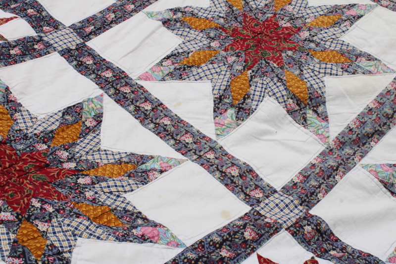 photo of cotton patchwork quilt eight pointed stars dark blue, barn red, yellow gold prints on white  #4