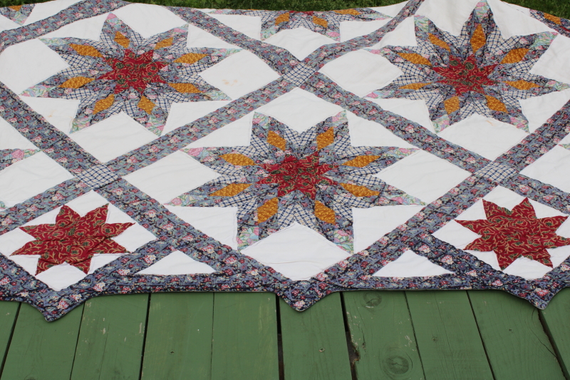 photo of cotton patchwork quilt eight pointed stars dark blue, barn red, yellow gold prints on white  #8