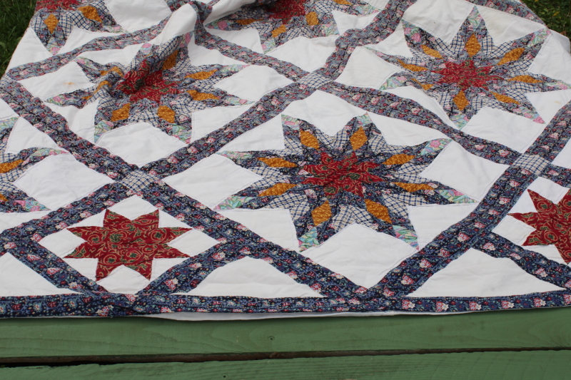 photo of cotton patchwork quilt eight pointed stars dark blue, barn red, yellow gold prints on white  #9