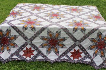 catalog photo of cotton patchwork quilt eight pointed stars dark blue, barn red, yellow gold prints on white 