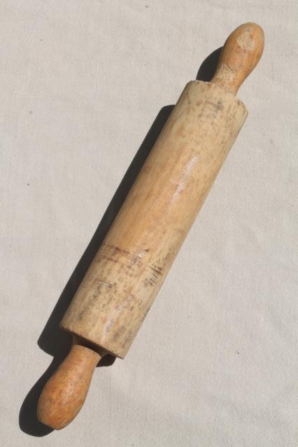 photo of country primitive antique wood rolling pin in rustic old wire wall holder rack #10