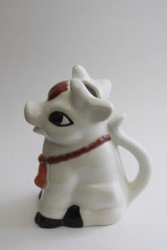 cow cream pitcher, hand painted ceramic creamer, sitting up cow w/ brown & white spots