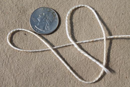 photo of creamy white antique colors primitive grubby old spools of vintage cotton cord thread #8