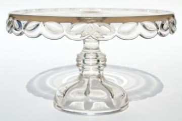 catalog photo of crystal clear vintage pressed glass cake stand, laurel leaf wreath pedestal plate