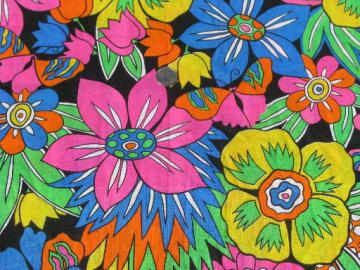 catalog photo of day-glo bright neon flowers on black, 80s retro vintage cotton fabric