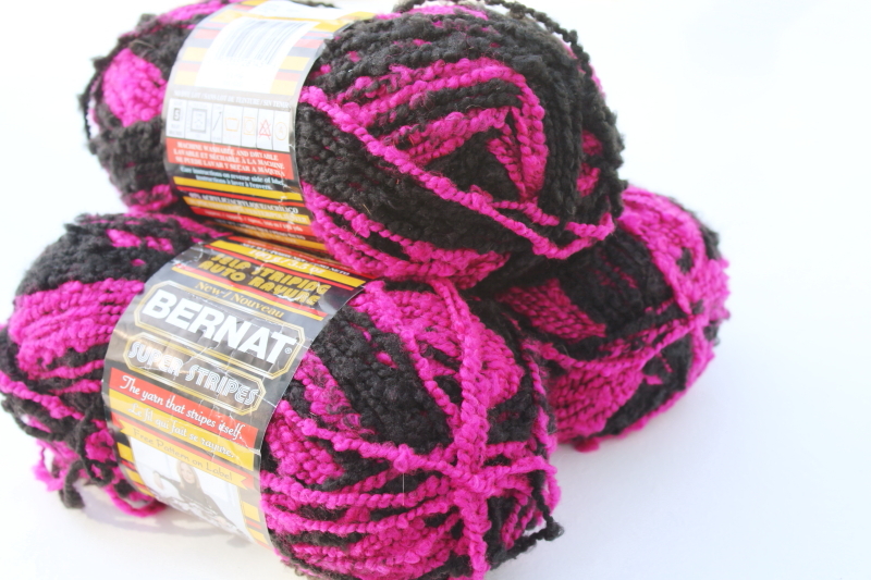 photo of discontinued Bernat Super Stripes magenta pink black self striping yarn soft boucle texture #4