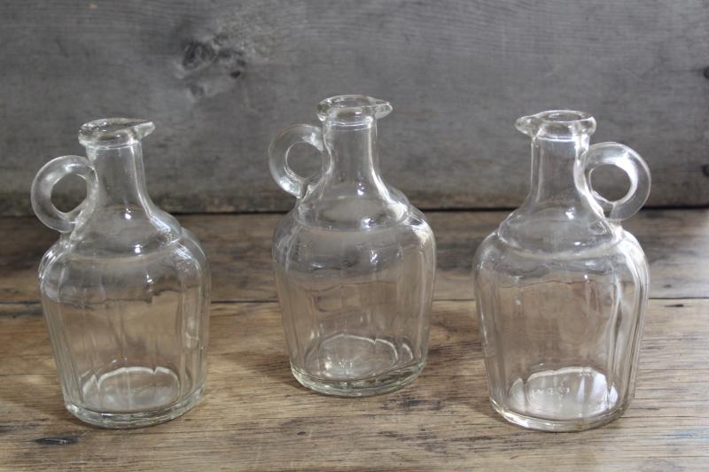 photo of early 1900s vintage maple syrup bottles, jug shape pressed glass pitchers #1