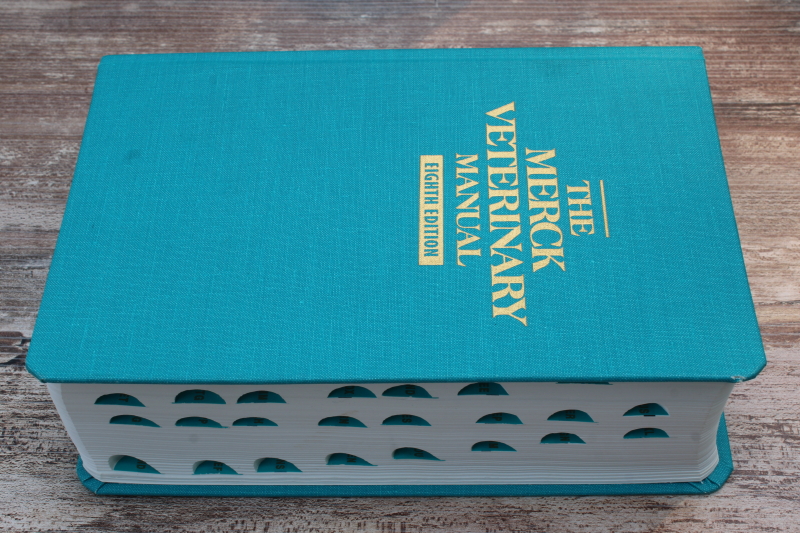 photo of eighth edition Merck Veterinary Manual 1998, large & small animals medical reference book #3
