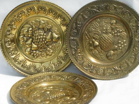 photo of embossed solid brass chargers, large plates or trays, fruit patterns #1