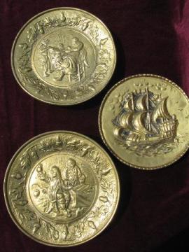 catalog photo of embossed solid brass chargers, old England scenes wall pocket plates