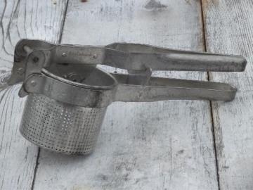 catalog photo of extra large potato ricer food mill, all metal strainer sieve masher