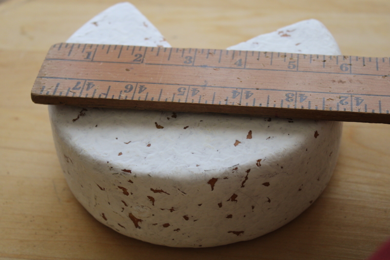 photo of fake food wheel of French cheese, rustic kitchen photo prop stylist display faux cheese #4