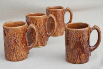 catalog photo of fern pattern tankard cups or steins, old brown glazed yellow ware pottery