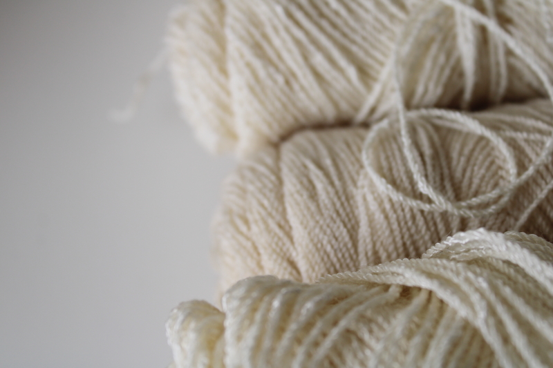 photo of fine boucle texture wool rayon blend yarn, fingering weight Melrose Cravenella ivory white #4