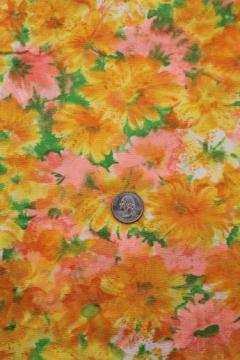 catalog photo of fine cotton plisse textured fabric, 60s vintage watercolor floral print in orange / yellow