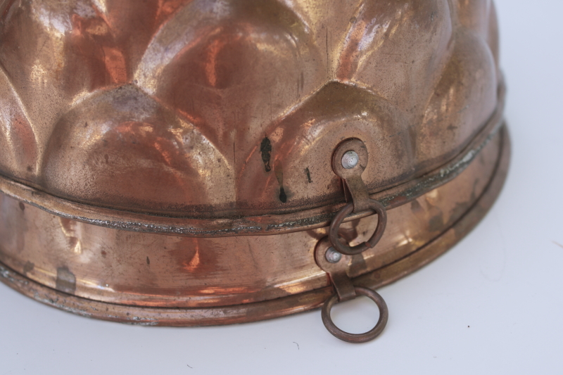 photo of french country style vintage copper molds or bundt pans, fluted round flower shapes  #8