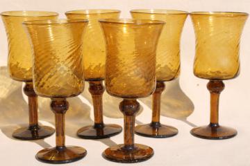 catalog photo of hand blown amber glass wine glasses, vintage Mexican art glass swirl spiral goblets