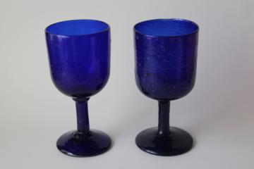 catalog photo of hand blown bubble glass goblets, rustic wine glasses, vintage Mexican glass cobalt blue stemware