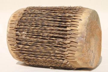 catalog photo of hand crafted rawhide laced leather drum, rough wood log w/ twisted hide lacing