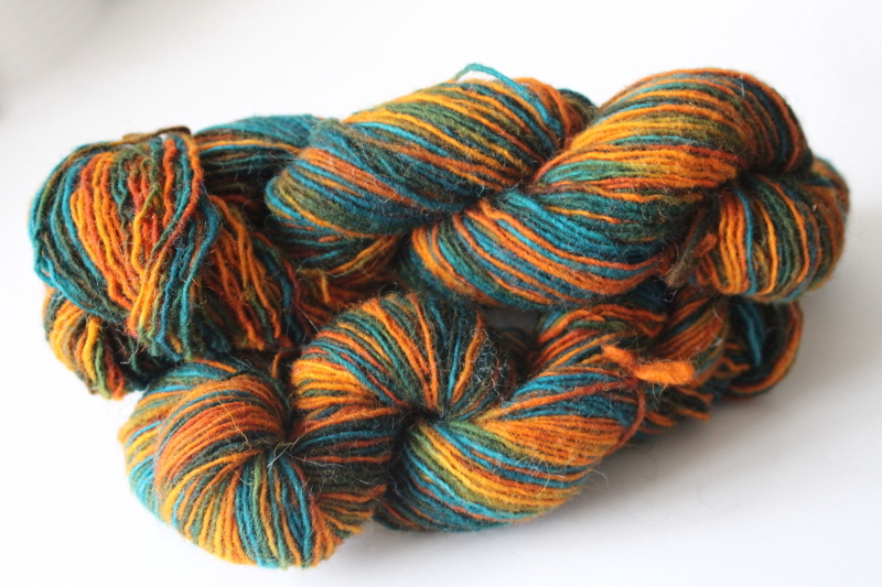 photo of hand dyed & spun wool yarn sunset orange shades w/ turquoise blue & green, three 50 gram hanks  #1