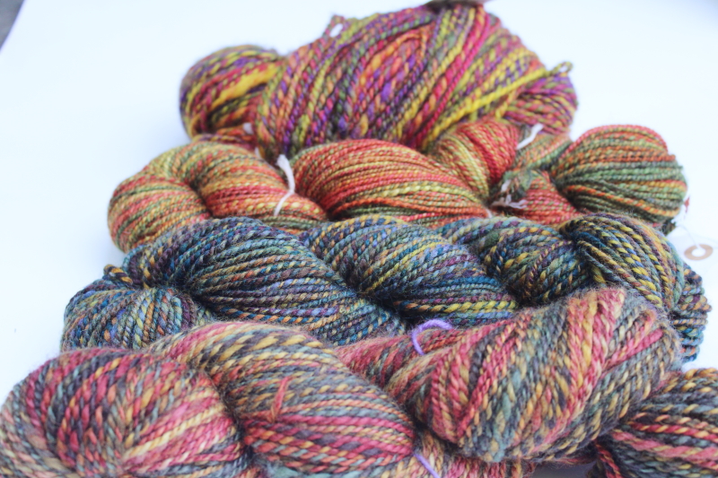 photo of hand spun artist dyed wool yarn lot, four hanks multicolored warm tones w/ gold, fall harvest colors  #1