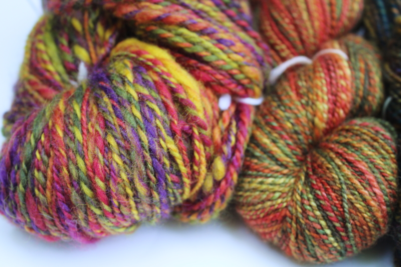 photo of hand spun artist dyed wool yarn lot, four hanks multicolored warm tones w/ gold, fall harvest colors  #2