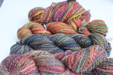 catalog photo of hand spun artist dyed wool yarn lot, four hanks multicolored warm tones w/ gold, fall harvest colors 