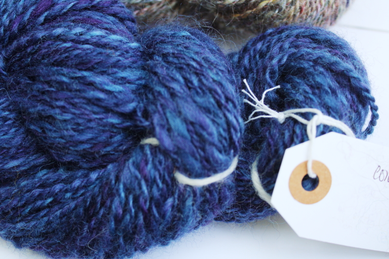 photo of hand spun artist dyed wool yarn lot, six hanks blues heather purple cream shades #4