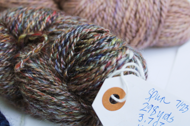 photo of hand spun artist dyed wool yarn lot, six hanks blues heather purple cream shades #5