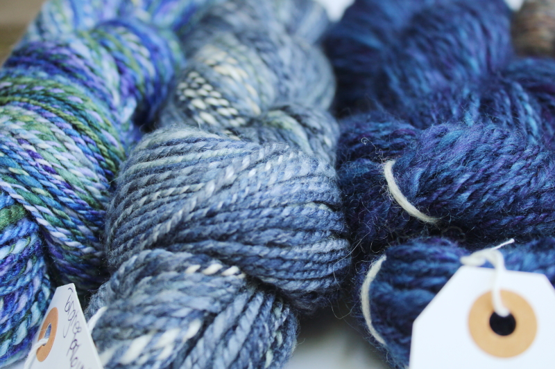 photo of hand spun artist dyed wool yarn lot, six hanks blues heather purple cream shades #9