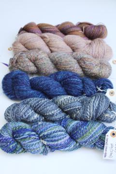 catalog photo of hand spun artist dyed wool yarn lot, six hanks blues heather purple cream shades 