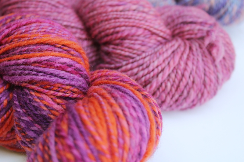 photo of hand spun artist dyed wool yarn lot, six hanks plum pink & purple shades #3