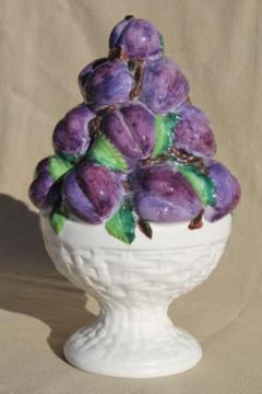 catalog photo of hand-painted Italian ceramic tabletop topiary fruit, a pyramid of purple plums