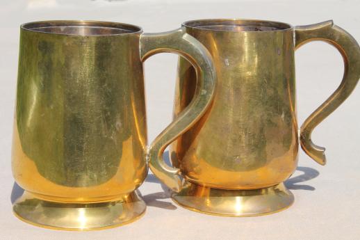photo of heavy brass beer steins or tankards, vintage cider mugs or tavern cups #2