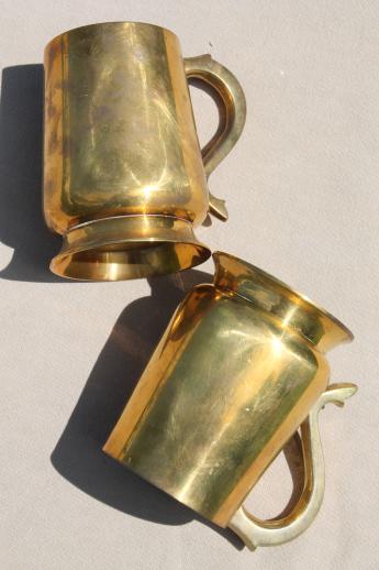 photo of heavy brass beer steins or tankards, vintage cider mugs or tavern cups #5