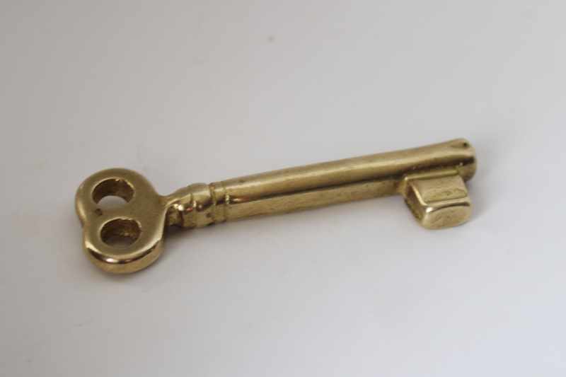 photo of heavy solid brass key paperweight, large skeleton key shape polished brass #1