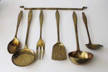 catalog photo of heavy solid brass kitchen utensils & wall hanging rack, large ladle, spoons, skimmer