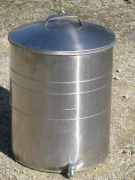 catalog photo of huge food service grade stainless steel pot w/ tap, tight lid