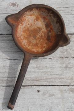 catalog photo of huge heavy antique cast iron ladle, old blacksmithing tool or lead melting pot