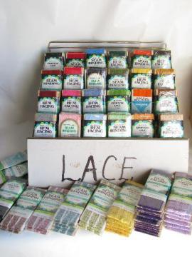 catalog photo of huge lot mod colors retro vintage lace trim, carded trims in display rack