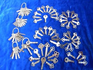 catalog photo of huge lot of 100 vintage old skeleton keys for cabinets, trunks, chests etc.