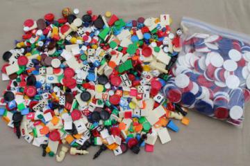 catalog photo of huge lot of assorted vintage game parts - playing pieces, tiles, dice, chips & counters