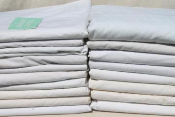 catalog photo of huge lot of plain white cotton bedsheets, flat bed sheets, vintage bedding