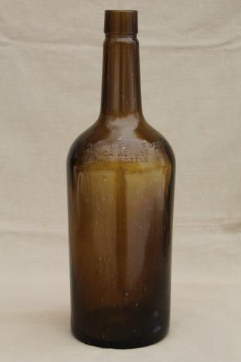 photo of huge old green glass bottle, vintage whisky bottle big one gallon size #1