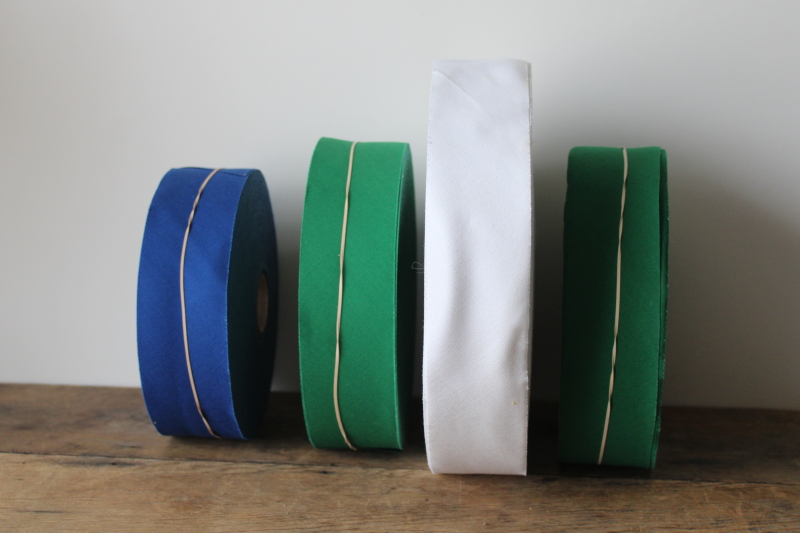 photo of huge rolls cotton broadcloth bias cut seam tape quilt binding new old stock vintage sewing supplies #7