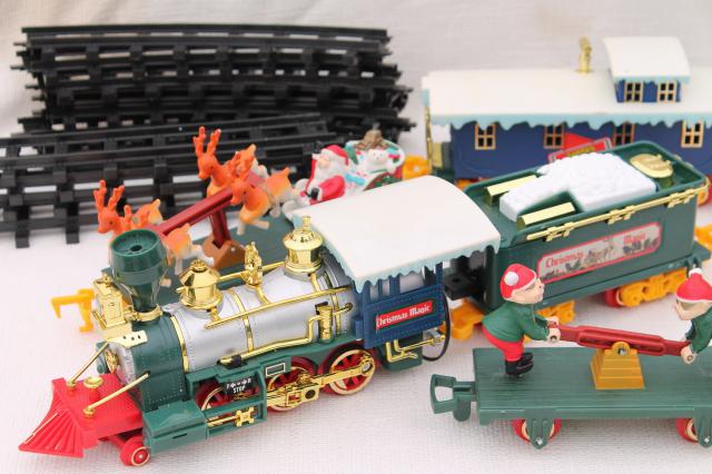 photo of large Santa Claus train, working plastic electric train for Christmas village or under the tree #1