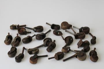 catalog photo of large lot old antique vintage furniture casters, assorted mismatched wood & metal wheels 