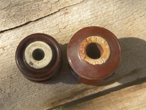 photo of large old brown ceramic round insulators for architectural or farm #2